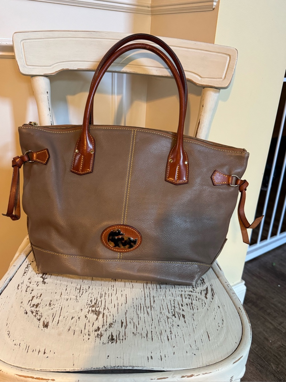 Dooney & Bourke Leather Champ Tote Bag with Brown Trim and tortoise duck logo